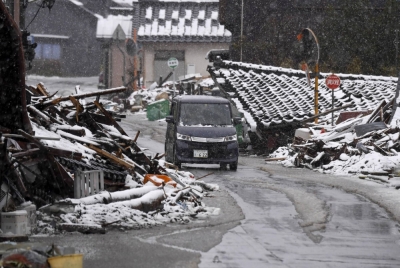 Homes destroyed in the New Year's Day earthquake line a road in Suzu, Ishikawa Prefecture, on March 3.