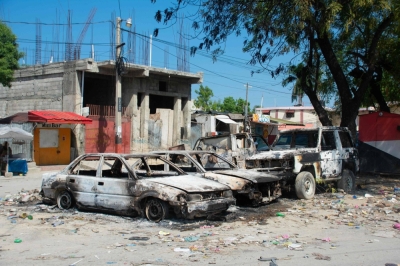 Charred vehicles amid escalating gang violence in Port-au-Prince, Haiti, on Saturday