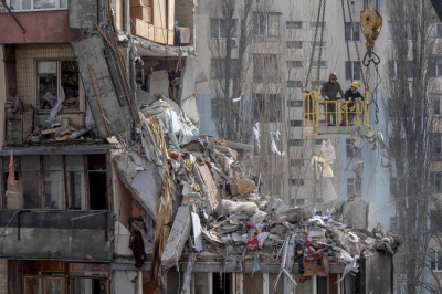Rescuers clear debris from a multistory building heavily damaged following a drone strike, in Odessa, Ukraine, on March 3. 