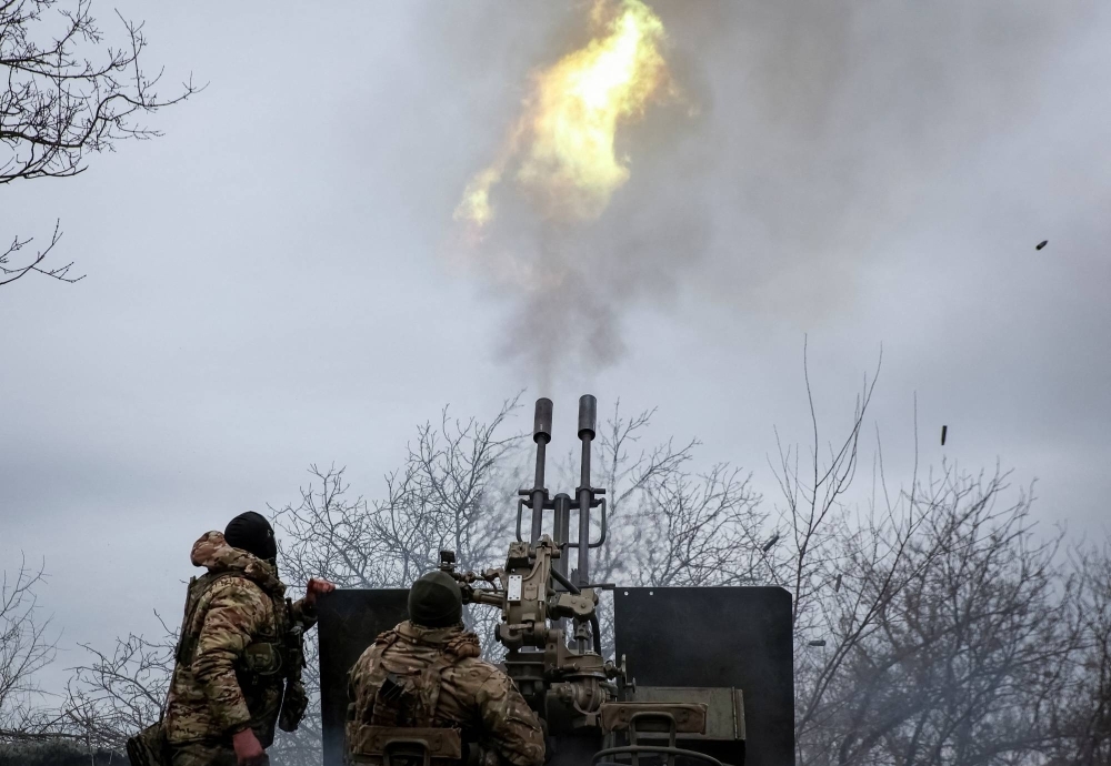 Ukrainian servicemen fire an anti aircraft cannon near the town of Bakhmut, Ukraine, on March 6.
