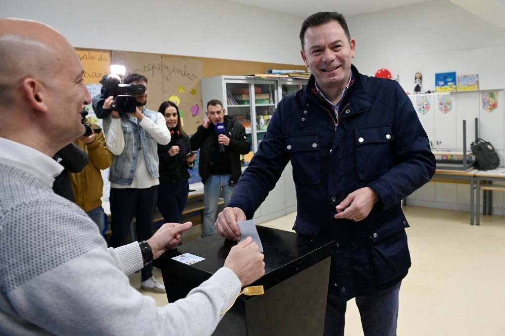 Portugal's Democratic Alliance (AD) leader Luis Montenegro casts his ballot a polling station in Espinho, near Porto, during the legislative elections held on Sunday.