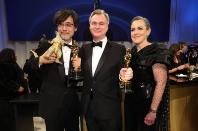Christopher Nolan and Emma Thomas, winners of the Oscar for best picture for "Oppenheimer," pose with Takashi Yamazaki, winner of the Oscar for best visual effects for "Godzilla Minus One," at the Governors Ball, following the 96th Academy Awards in Hollywood, California, on Sunday.