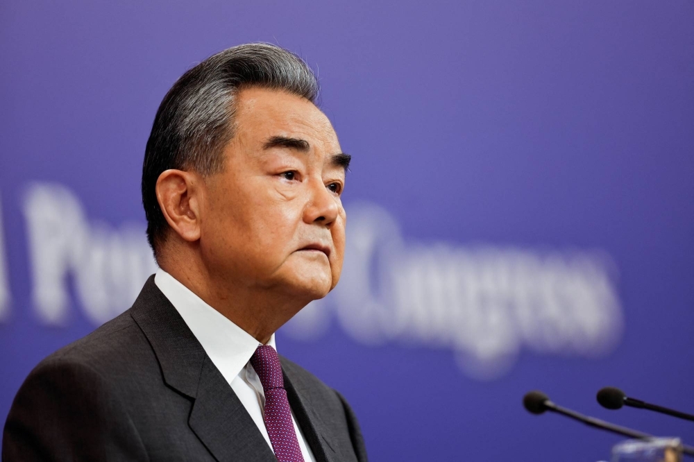 Chinese Foreign Minister Wang Yi attends a press conference on the sidelines of the National People's Congress in Beijing on Thursday.
