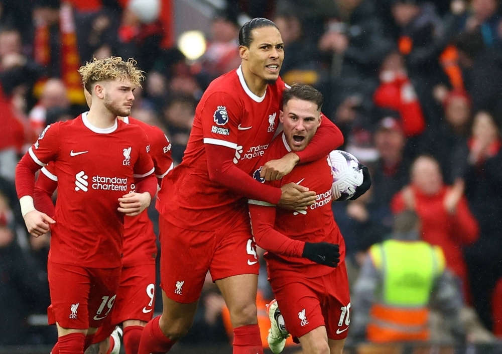 Liverpool's Alexis Mac Allister (right) celebrates after scoring against Manchester City during their match in Liverpool, England, on Sunday.