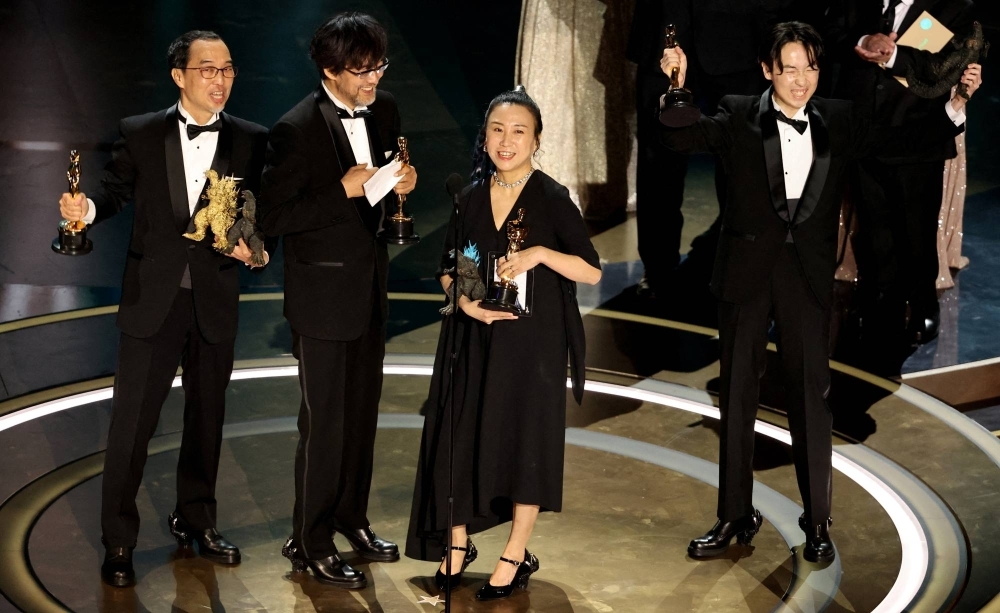 Masaki Takahashi, Takashi Yamazaki, Kiyoko Shibuya and Tatsuji Nojima celebrated winning the Oscar for best visual effects on the Dolby Theatre stage in Los Angeles, California, on Sunday.