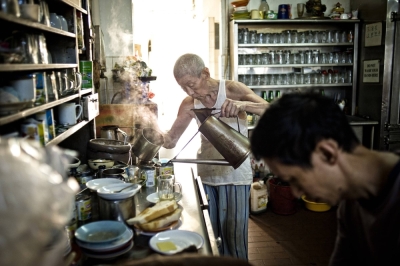 Shi Pong Hsu, 75, makes coffee in a Singapore coffee shop. The city-state's government projects that almost a quarter of its population will be 65 or over by 2030.