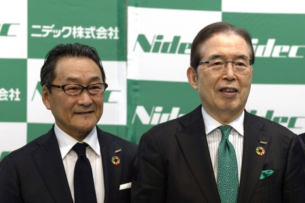 Mitsuya Kishida, incoming CEO of Nidec (left), and Shigenobu Nagamori, chairman and CEO, during a news conference at the company's headquarters in Kyoto on Feb. 14.