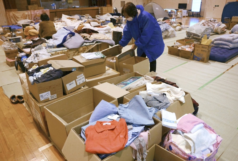 Boxes of clothes at an evacuation center in Suzu, Ishikawa Prefecture, on Saturday. Disasters have highlighted issues regarding the inadequate supply of essentials for women and children as well as the necessity for privacy in evacuation centers.