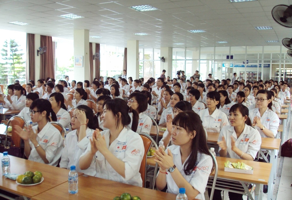 A group of Vietnamese care workers attend a send-off event before heading to Japan, in Trung Hoa, Vietnam, 2014.