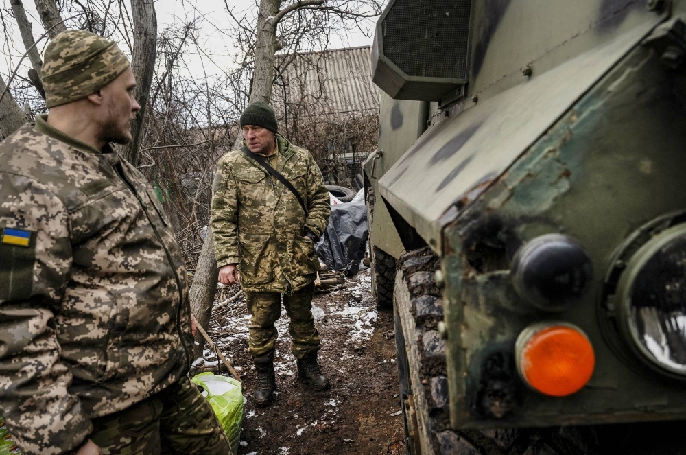 Ukrainian soldiers who recently pulled out of Avdiivka, Ukraine, replenish supplies in a nearby village on Feb. 19.
