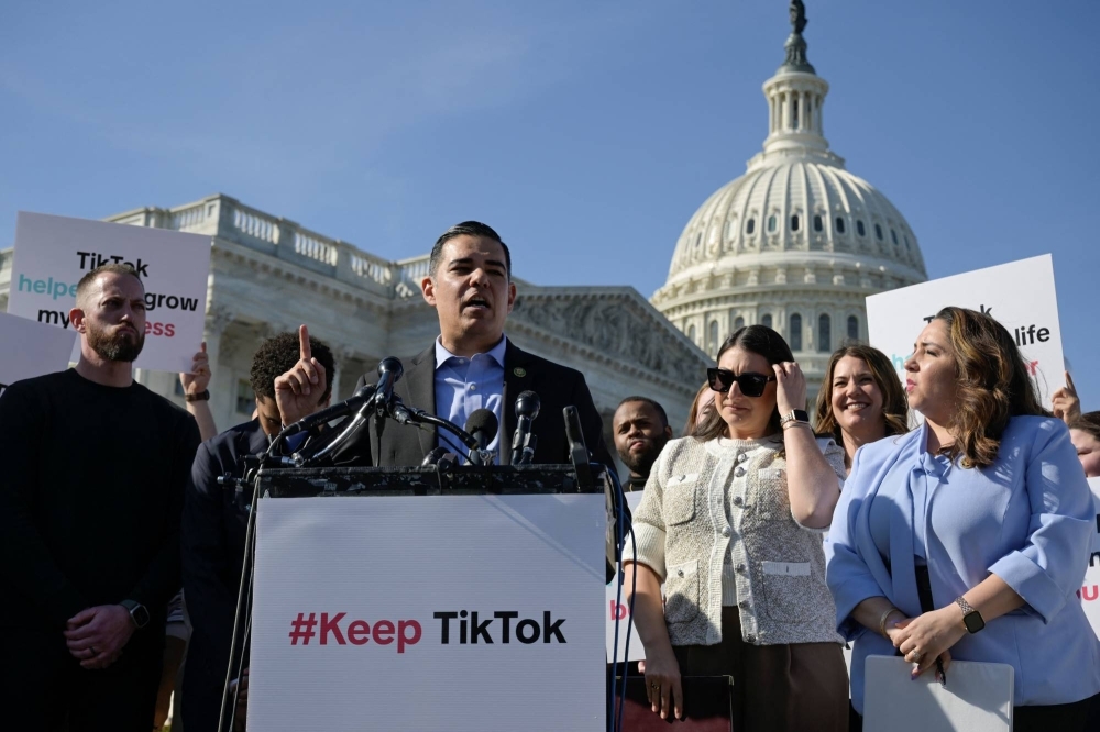 Several U.S. lawmakers along with TikTok creators hold a news conference to voice their opposition to the Protecting Americans from Foreign Adversary Controlled Applications Act in Washington on Tuesday.