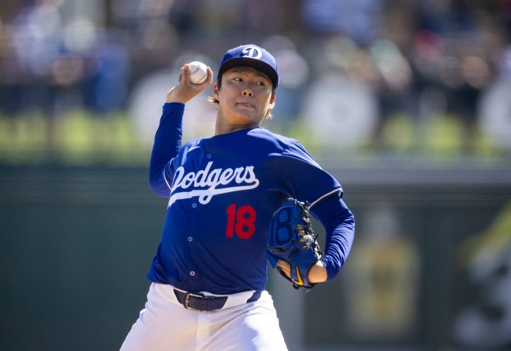 Dodgers starter Yoshinobu Yamamoto pitches against the Mariners during a spring training start in Glendale, Arizona, on Wednesday.