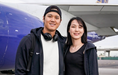 A picture posted on the Dodgers' official X account of Shohei Ohtani, with a description of the photo saying the woman is his wife, who was later identified as Mamiko Tanaka.