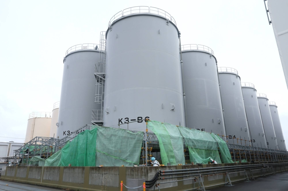 Tanks containing treated radioactive water at the Fukushima No. 1 nuclear power plant in Fukushima Prefecture in January. The quake prompted the plant's operator to suspend the release of treated radioactive water into the sea from the complex, which it began on Feb. 28.