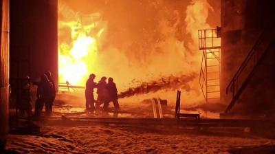 An image taken from video released by Roman Starovoit, governor of the Kursk region of Russia, last month purportedly shows firefighters working to extinguish flames at an oil depot after a Ukrainian drone strike.