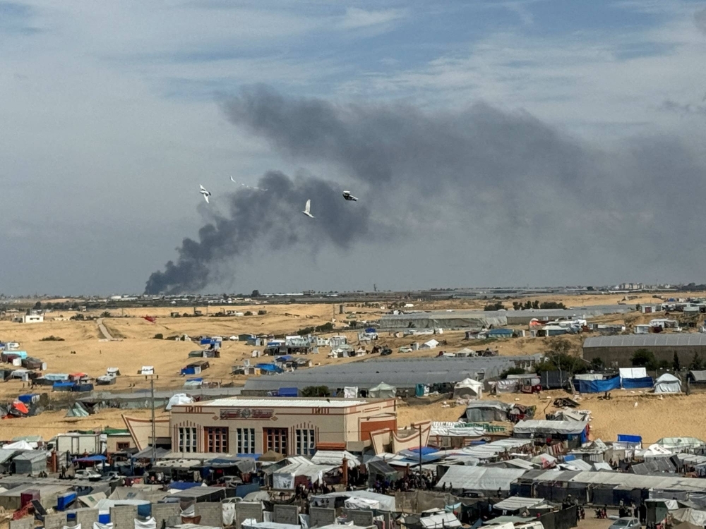 Smoke rises during an Israeli ground operation in Khan Younis, as seen from a tent camp sheltering displaced Palestinians in Rafah, in the southern Gaza Strip on Thursday.