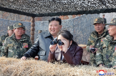 North Korean leader Kim Jong Un and his daughter inspect a drill by the Korean People's Army at an undisclosed location in North Korea in this image released Saturday. 