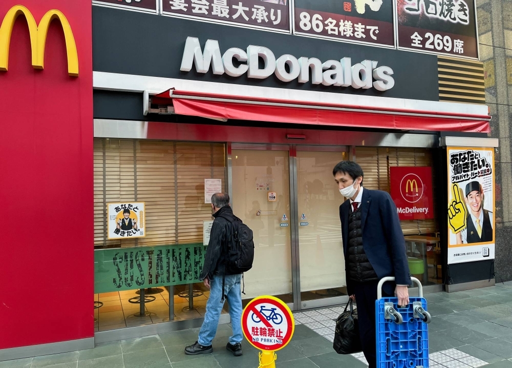 A closed McDonald's in Tokyo on Friday after a tech issue forced outlets of the burger chain to shut around the world.