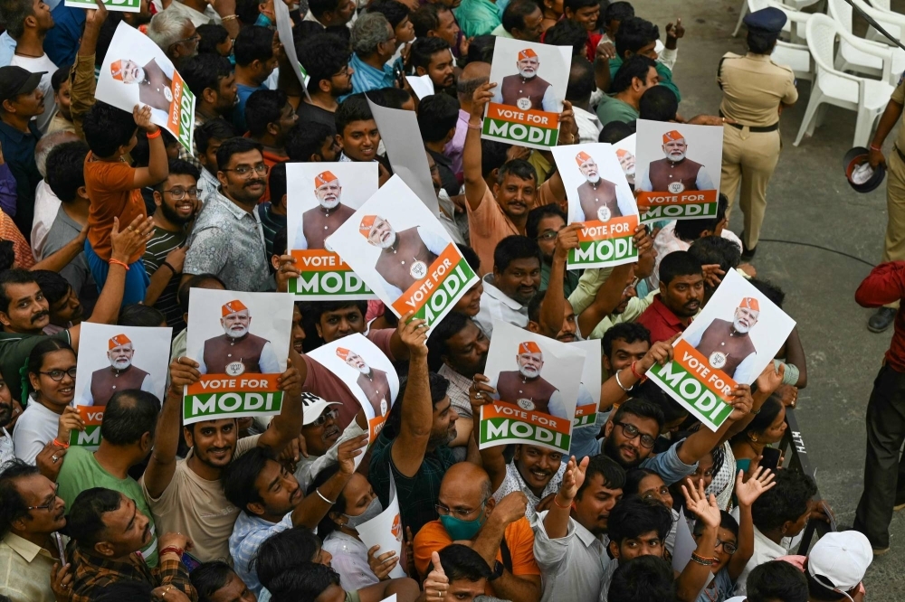 Supporters await the arrival of Indian Prime Minister Narendra Modi at a campaign event in Hyderabad on Friday. 