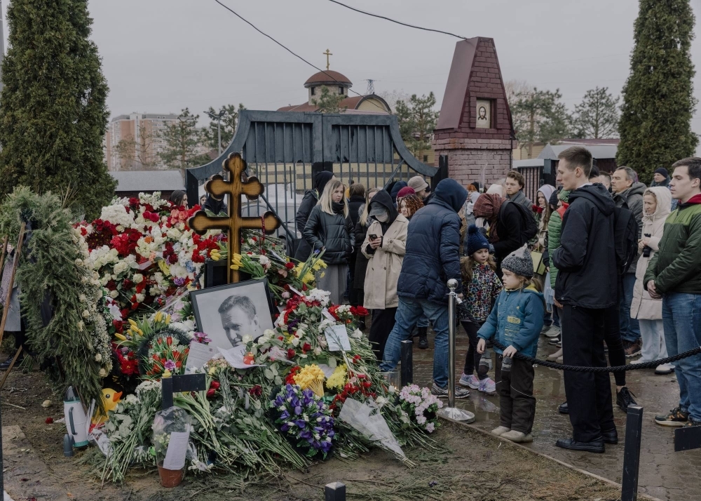 Mourners at the grave of Alexei Navalny in Moscow on Sunday