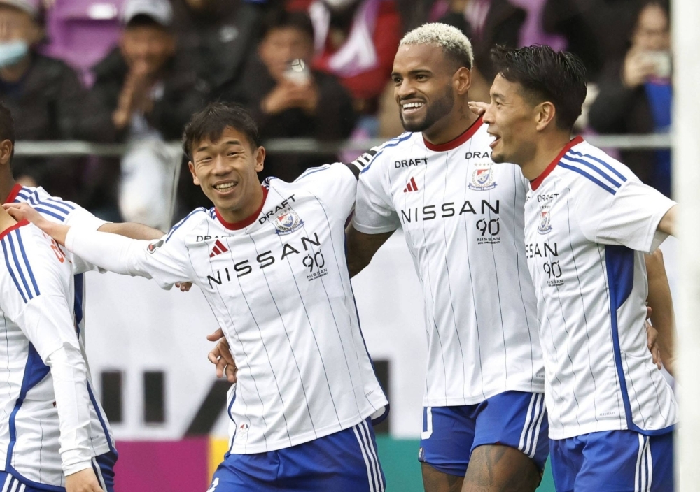 Yokohama F. Marinos' Anderson Lopes (second from right) celebrates after scoring against Kyoto Sanga in Kameoka, Kyoto Prefecture, on Sunday.