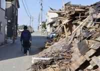 A street in Wajima, Ishikawa Prefecture, is still filled with rubble on March 16, more than two months after the Jan. 1 quake. | Kyodo