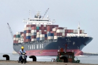 A container ship passes at Keelung port in northern Taiwan in July 2010. | REUTERS