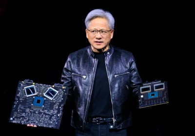 Nvidia's CEO Jensen Huang displays products onstage during the annual Nvidia GTC Artificial Intelligence Conference at SAP Center in San Jose, California, on Monday.
