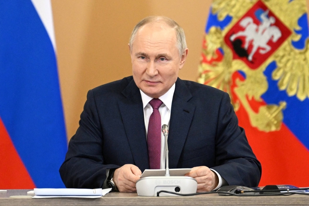 Russian President Vladimir Putin attends a meeting in Moscow in February via video link.
