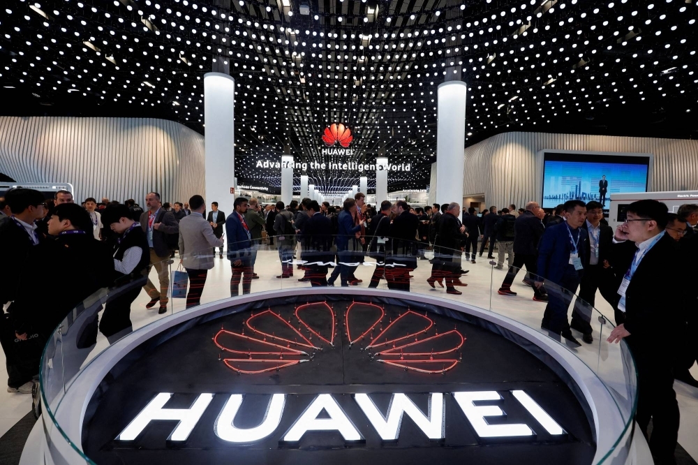 People visit the Huawei stand at the 2024 Mobile World Congress in Barcelona last month.