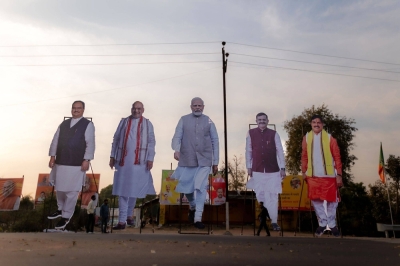 Giant cut-outs of Indian Prime Minister Narendra Modi and other party leaders are positioned beside a road in the Indian state of Madhya Pradesh on Feb. 25.