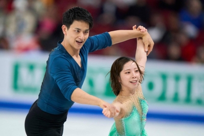 Ryuichi Kihara and Riku Miura compete during the World Figure Skating Championships in Montreal on Wednesday.