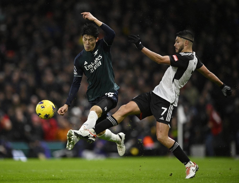Arsenal's Takehiro Tomiyasu (left) in action during a game against Fulham on Dec. 31