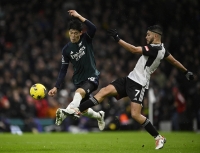 Arsenal's Takehiro Tomiyasu (left) in action during a game against Fulham on Dec. 31 | Reuters