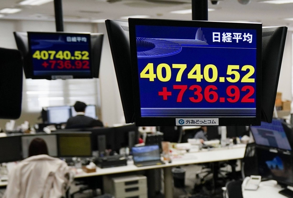 A monitor showing the Nikkei index on Thursday