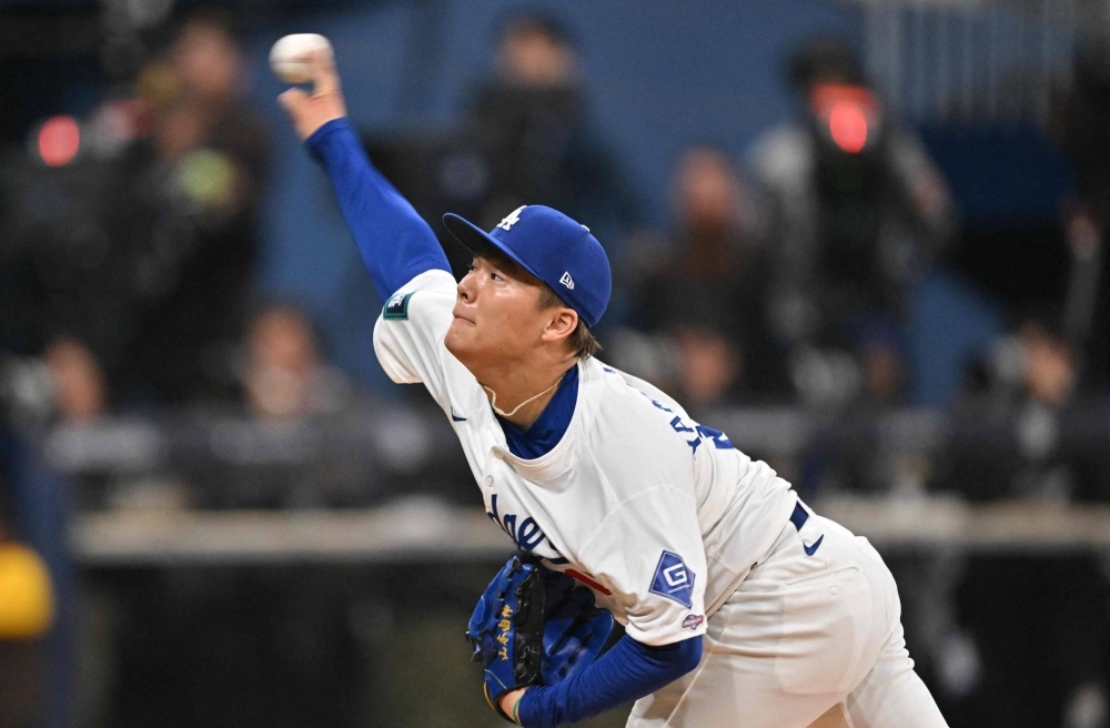 Dodgers' pitcher Yoshinobu Yamamoto pitches during the first inning of his MLB debut in Seoul. The outing was one to forget for the former Orix Buffaloes ace. 