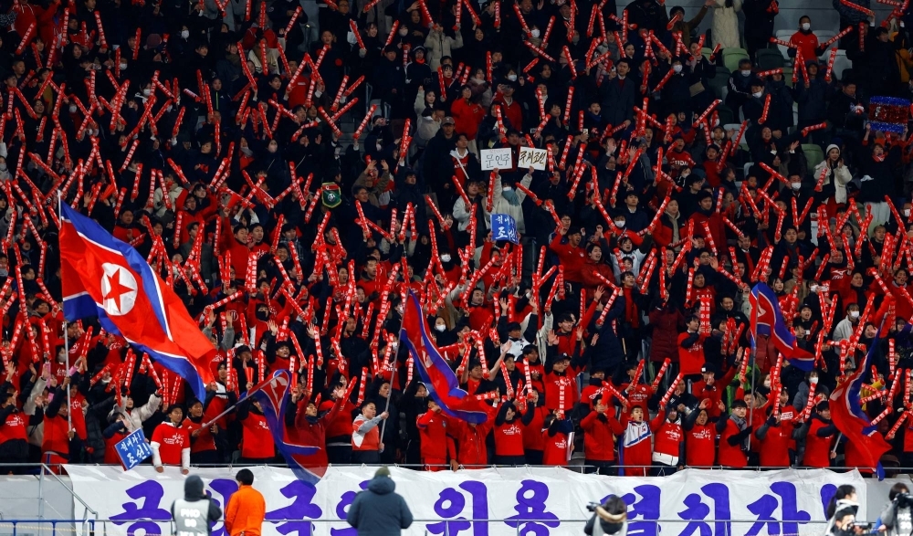 North Korean fans watch the World Cup qualifying match between Japan and North Korea on Thursday in Tokyo.