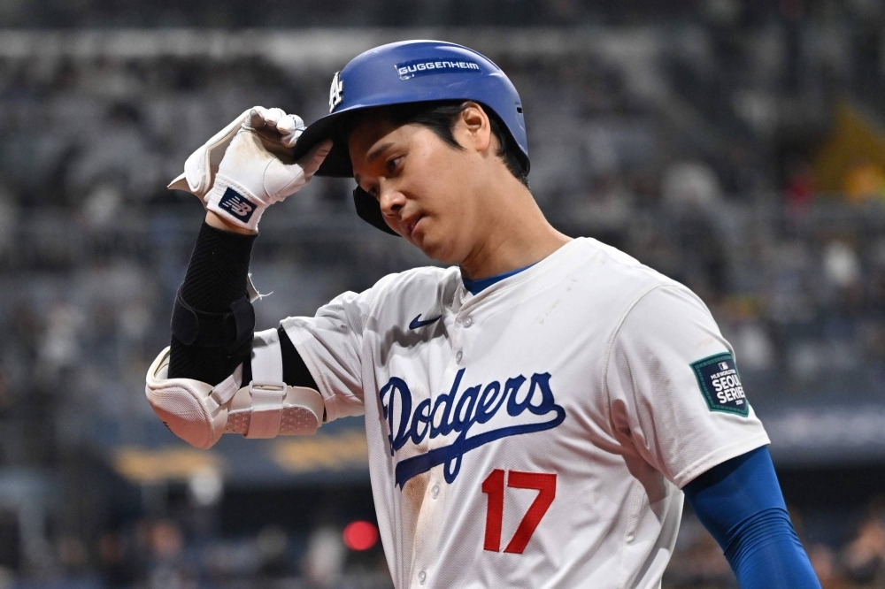 Dodgers slugger Shohei Ohtani reacts after flying out in the seventh inning of the team's game against the Padres in Seoul on Thursday. 