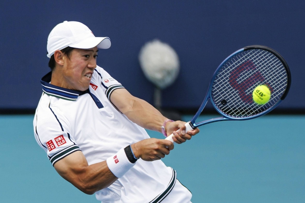 Kei Nishikori, in his first ATP Tour tournament since last summer, hits a backhand during his opening round defeat to Sebastian Ofner on Thursday in Miami. 