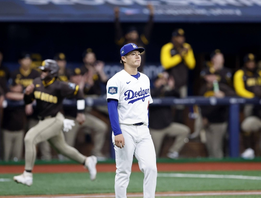 Dodgers pitcher Yoshinobu Yamamoto looks on after the Padres' Luis Campusano hit an RBI double in the top of the first inning of his MLB debut in Seoul on Thursday.