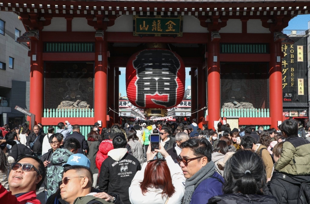 Foreign tourists visit Sensoji Temple in the Asakusa area of Tokyo. As of the end of December, 3,410,992 foreign nationals resided in Japan, up 10.9% from the previous year.