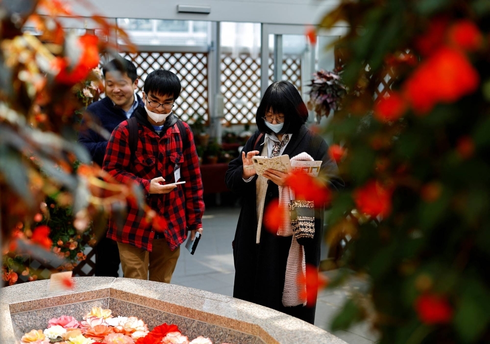 Participants take part in a matchmaking event organized by the Tokyo Metropolitan Government at Jindai Botanical Gardens on Wednesday.