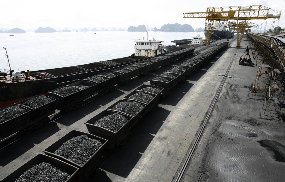 Containers transporting coal at a dock in Cam Pha, Vietnam. Enthusiasm for Vietnam’s renewables boom is dampened by factors such as its underdeveloped electricity grid and patchy regulatory framework, while the country’s major source of electricity remains coal.
