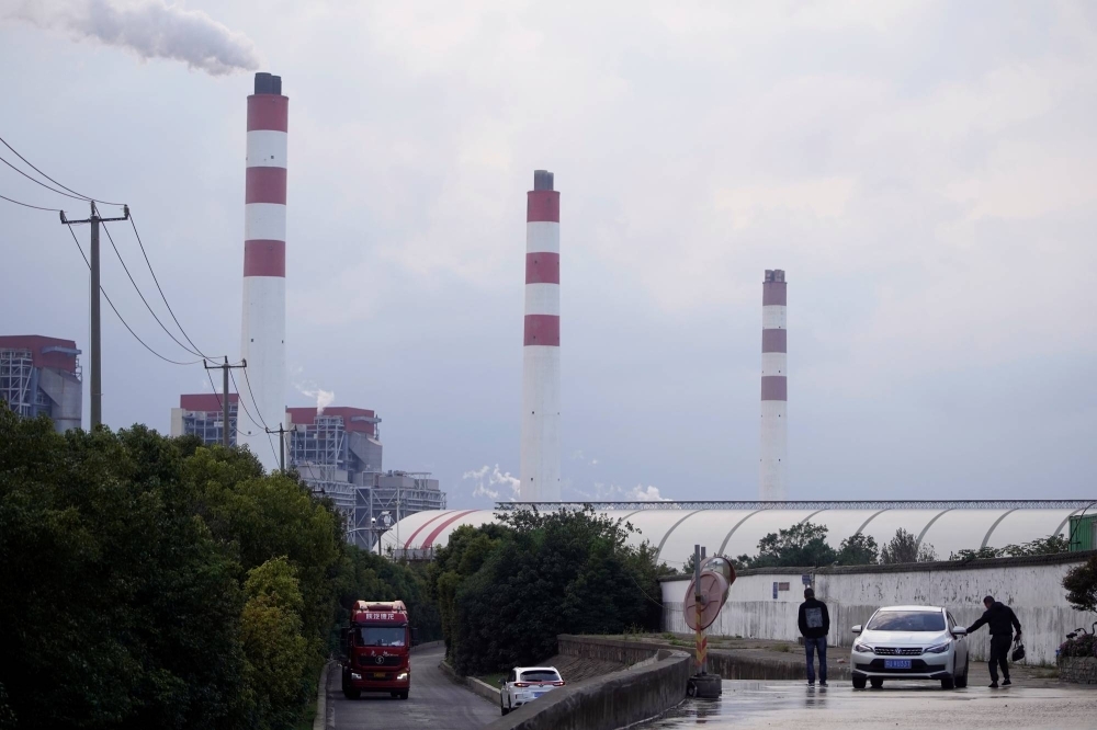 A coal-fired power plant in Shanghai in October 2021. For years, analysts expected coal production to plateau after it hit a then-record in 2013. Then came 2021, when power shortages in China set Beijing on a path to order more mining to ensure energy security.