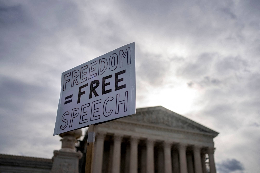 Demonstrators rally outside the U.S. Supreme Court in Washington on March 18 as justices hear arguments on whether the 
government has the right to encourage social media companies to remove content it deems misinformation. 