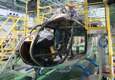 A worker helps assemble the fuselage of a BK117 helicopter at Kawasaki Heavy Industries’ Gifu plant in Kakamigahara, Gifu Prefecture.