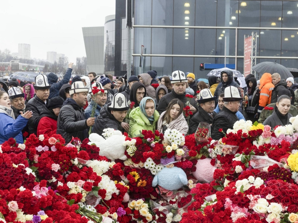 People lay flowers on Sunday at a memorial near the Crocus City Hall outside Moscow, where over 130 people were killed and more than 140 injured Friday night in an attack. 