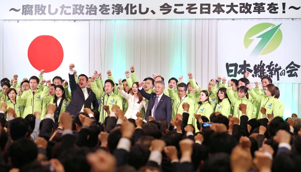Nobuyuki Baba, head of Nippon Ishin no Kai (front, center), and party members attend a party convention in the city of Kyoto on Sunday.