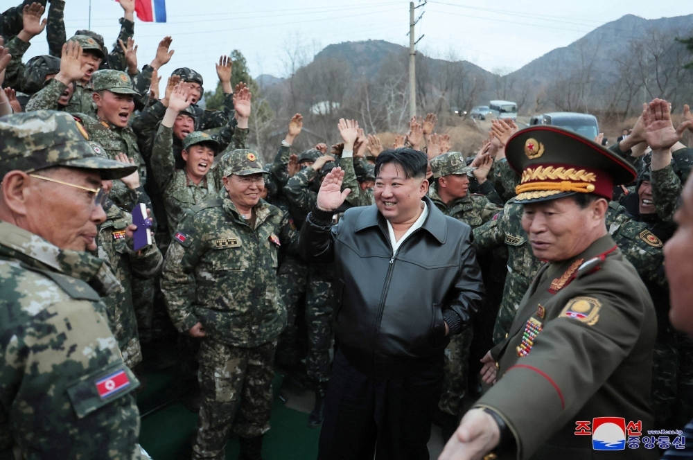 North Korean leader Kim Jong Un greets soldiers as he inspects a tank unit of the Korean People's Army in a photo released on Monday. 