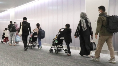Afghan evacuees arrive at Narita International Airport in October 2021. Applicants from Afghanistan made up the majority of those recognized as refugees by the Japanese government last year, similar to 2022.